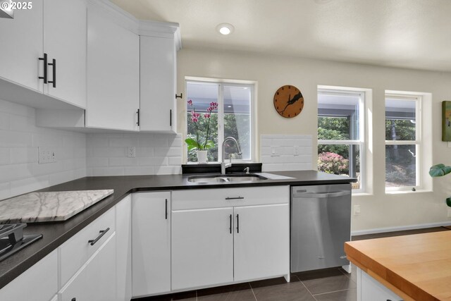 88005 Windleaf Way, Florence, OR 97439 - kitchen featuring tasteful backsplash, dishwasher, plenty of natural light, and a sink