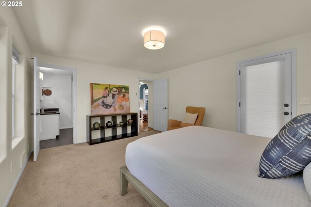 88005 Windleaf Way, Florence, OR 97439 - bedroom with arched walkways, baseboards, and carpet floors