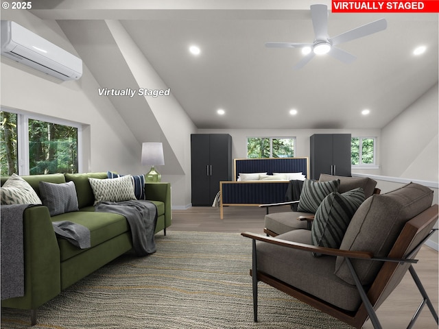 living area with wood finished floors, a wall mounted AC, recessed lighting, and ceiling fan