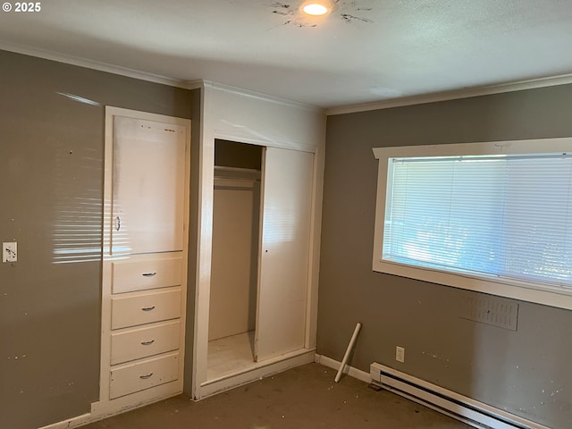 76464 High St, Oakridge, OR 97463 - unfurnished bedroom with a baseboard radiator, crown molding, a closet, and baseboards