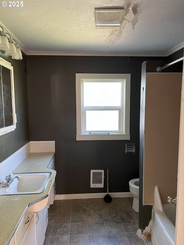 76464 High St, Oakridge, OR 97463 - bathroom with toilet, a shower, vanity, heating unit, and baseboards