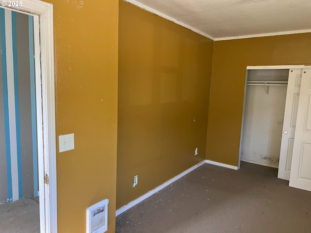 76464 High St, Oakridge, OR 97463 - unfurnished bedroom with concrete floors, a closet, ornamental molding, and baseboards