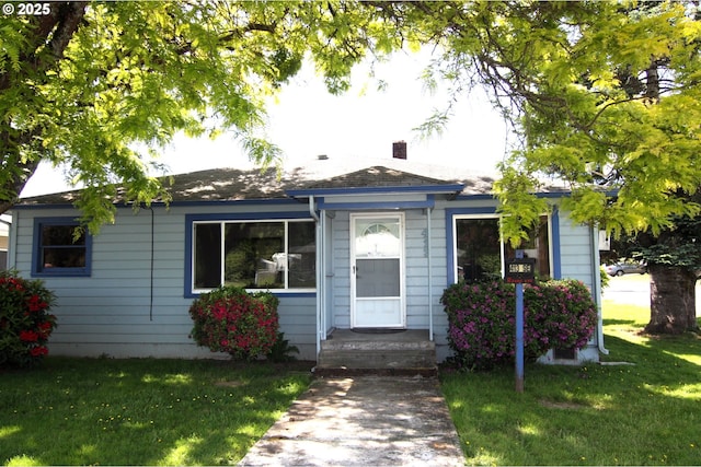 view of front of home with a front yard