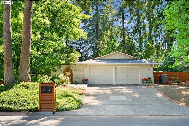 1152 SE 35th Ave, Hillsboro, OR 97123 - view of front facade with concrete driveway, a garage, and brick siding