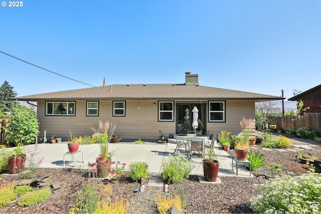 1900 E 10th St, The Dalles, OR 97058 - back of house featuring a chimney and a patio area