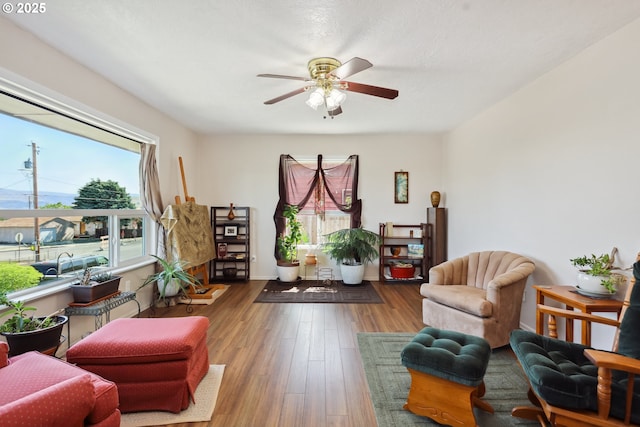 1900 E 10th St, The Dalles, OR 97058 - living area featuring a ceiling fan and wood finished floors