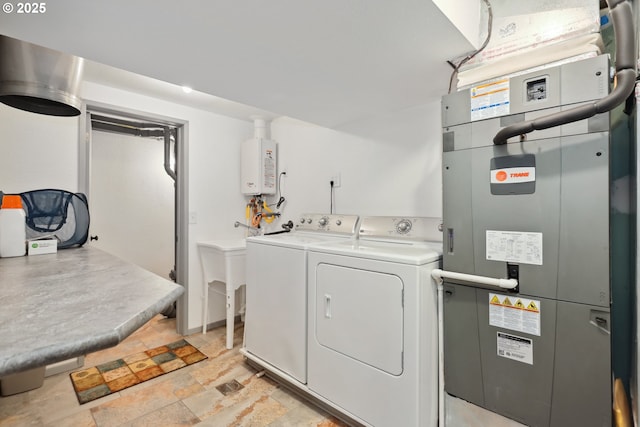 1900 E 10th St, The Dalles, OR 97058 - laundry area with washer and clothes dryer, tankless water heater, light stone finish floors, and heating unit
