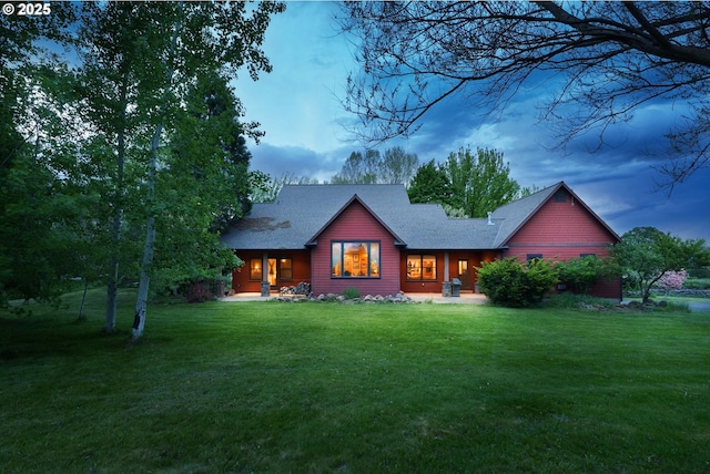 4069 Post Canyon Dr, Hood River, OR 97031 - rear view of house with a lawn, roof with shingles, and a porch