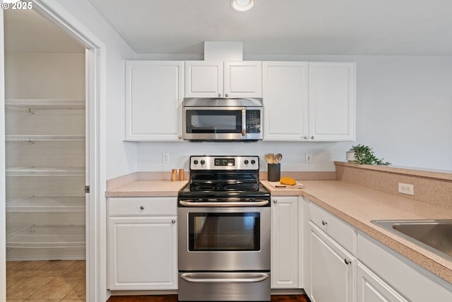 1608 NE 154th St, Vancouver, WA 98686 - kitchen featuring stainless steel appliances, white cabinets, and light countertops