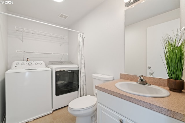 1608 NE 154th St, Vancouver, WA 98686 - bathroom featuring washer and clothes dryer, toilet, vanity, and a shower with curtain