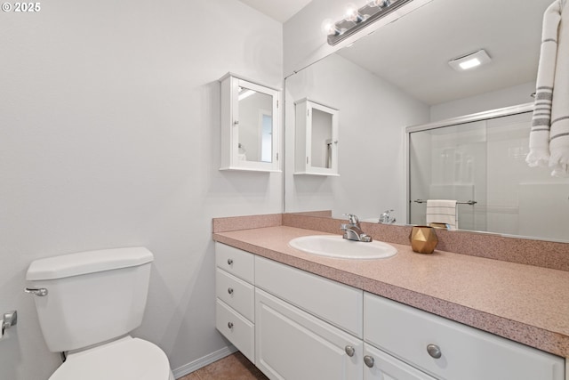 1608 NE 154th St, Vancouver, WA 98686 - bathroom featuring vanity, toilet, and a shower with shower door