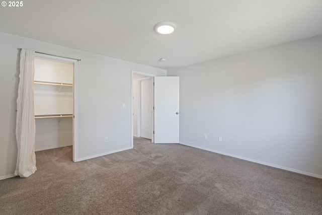 1608 NE 154th St, Vancouver, WA 98686 - unfurnished bedroom featuring carpet flooring, a walk in closet, baseboards, and a closet