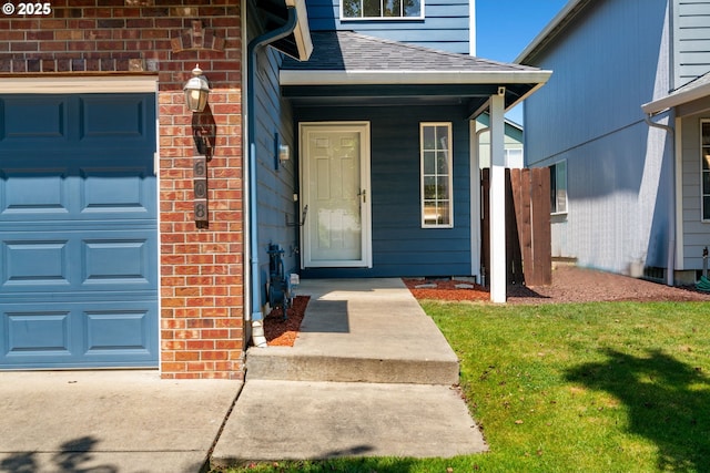 1608 NE 154th St, Vancouver, WA 98686 - entrance to property with covered porch, an attached garage, a lawn, roof with shingles, and brick siding