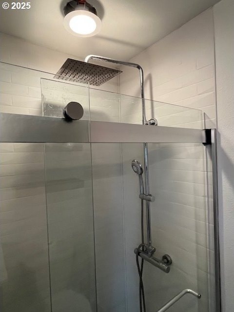 full bath with a shower stall