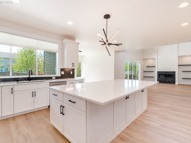 2650 NW Mt Ashland Dr, Mcminnville, OR 97128 - kitchen with a sink, light wood-style floors, recessed lighting, a kitchen island, and decorative backsplash
