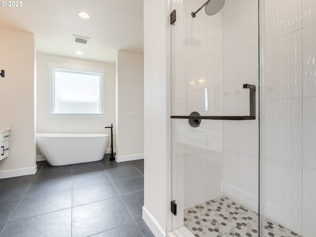 2650 NW Mt Ashland Dr, Mcminnville, OR 97128 - bathroom with a stall shower, a freestanding bath, baseboards, and recessed lighting