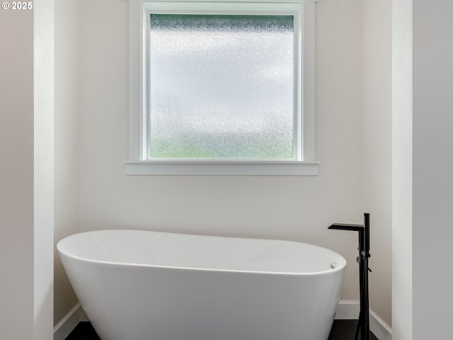 2650 NW Mt Ashland Dr, Mcminnville, OR 97128 - bathroom featuring a freestanding bath and baseboards