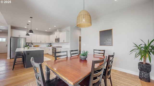 665 Browndell Ln, Stanfield, OR 97875 - dining room with baseboards, light wood-type flooring, and recessed lighting