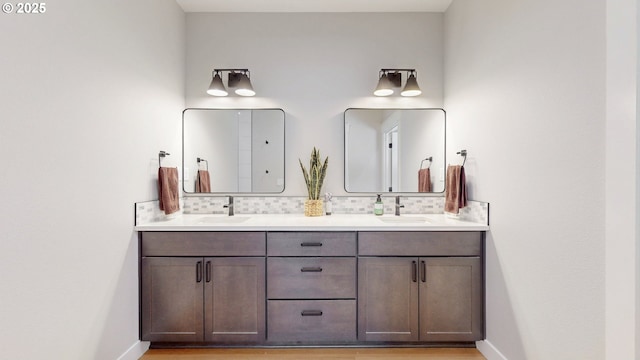 665 Browndell Ln, Stanfield, OR 97875 - full bathroom featuring backsplash, double vanity, and baseboards