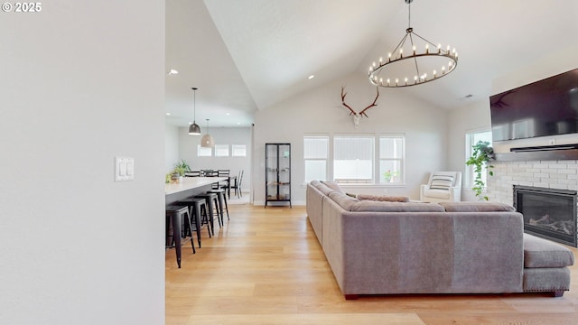 665 Browndell Ln, Stanfield, OR 97875 - living area featuring light wood-style flooring, a chandelier, plenty of natural light, high vaulted ceiling, and recessed lighting