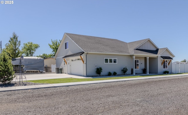 665 Browndell Ln, Stanfield, OR 97875 - modern farmhouse featuring board and batten siding, a garage, concrete driveway, and roof with shingles