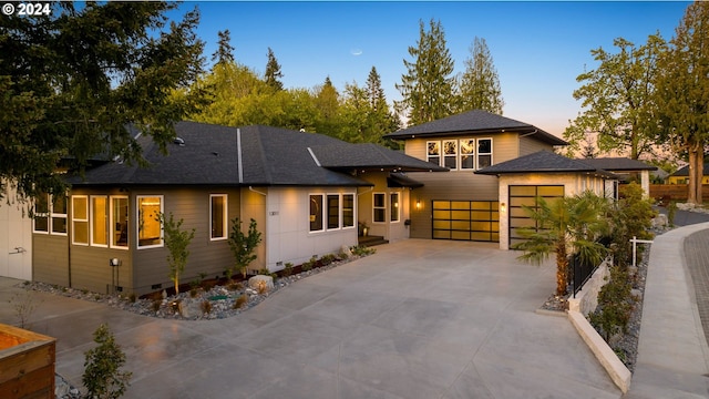 prairie-style home featuring a garage