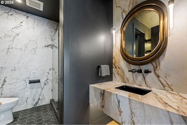 bathroom with toilet and sink