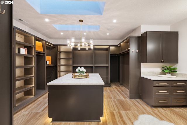 walk in closet with a skylight