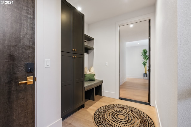 mudroom with light hardwood / wood-style flooring