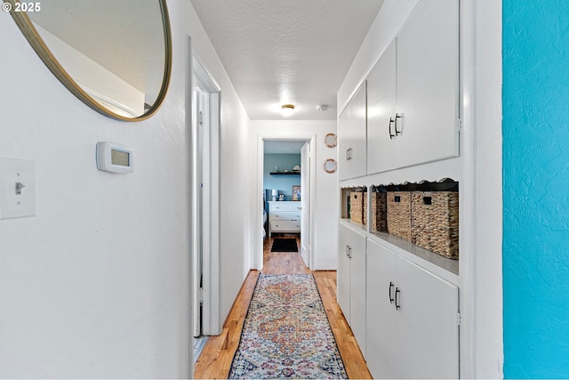 3505 Donald St, Eugene, OR 97405 - hallway with a textured ceiling and light wood-type flooring
