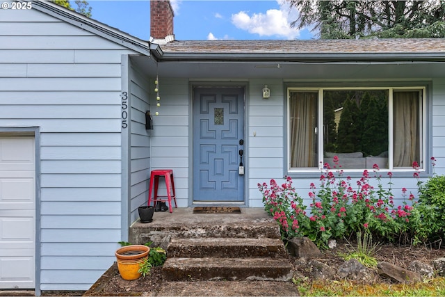 3505 Donald St, Eugene, OR 97405 - view of exterior entry with a chimney