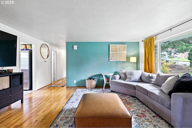 3505 Donald St, Eugene, OR 97405 - living area with a textured ceiling and wood finished floors