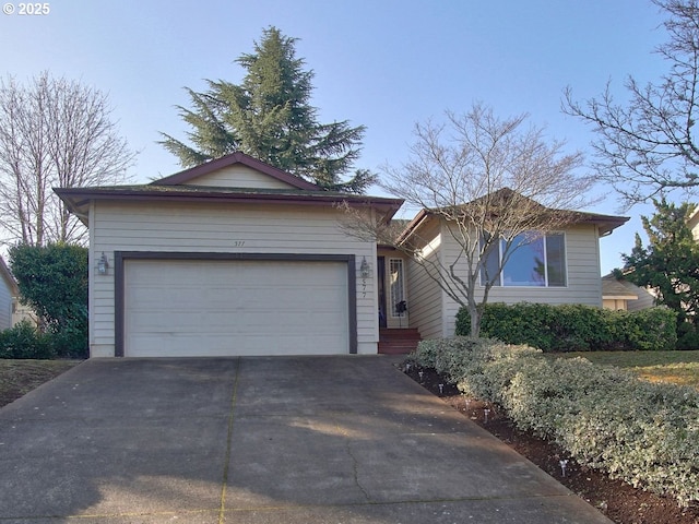 ranch-style home featuring driveway and an attached garage