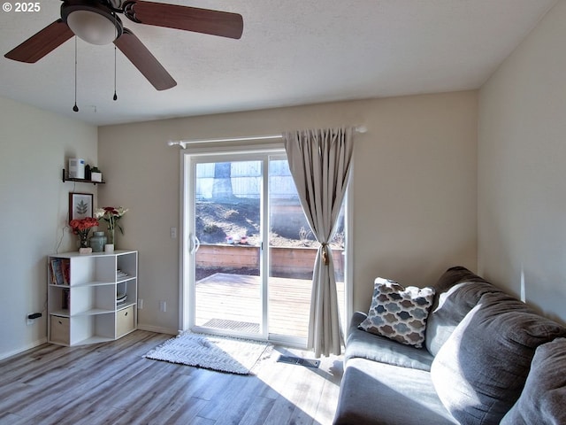 interior space featuring baseboards and wood finished floors