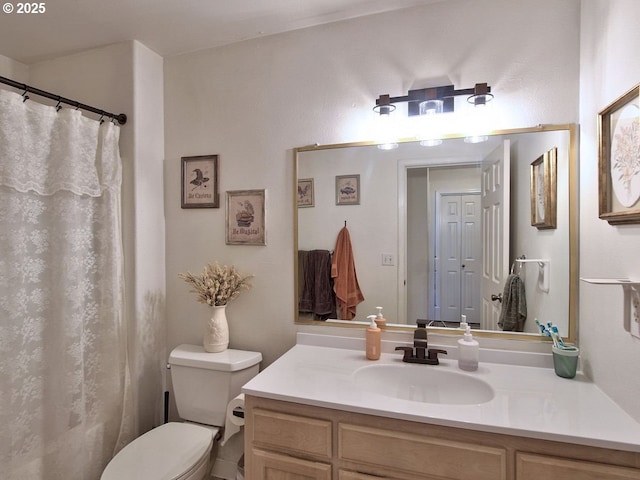 full bath featuring toilet and vanity