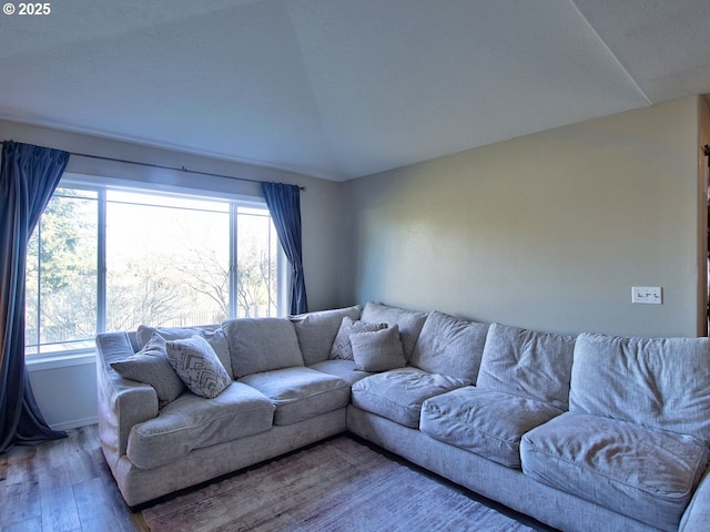 living area featuring wood finished floors and baseboards