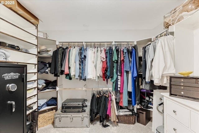 walk in closet featuring carpet floors