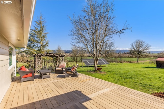 wooden deck featuring a yard and a rural view