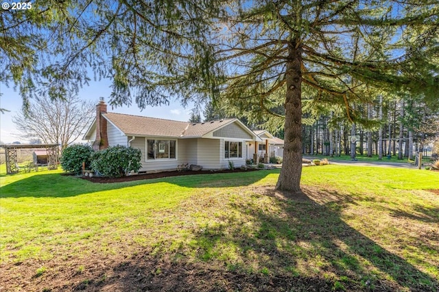 view of front of home with a front yard, crawl space, and a chimney