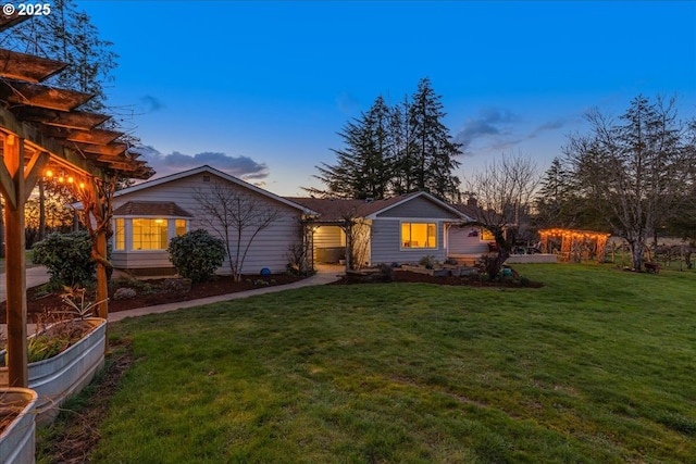 view of front of house with a lawn and a pergola