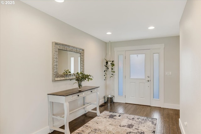 foyer entrance featuring recessed lighting, baseboards, and wood-type flooring