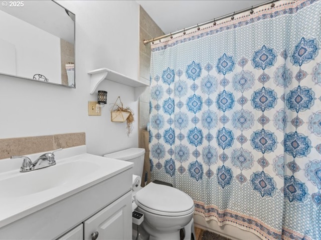 bathroom featuring vanity, a shower with shower curtain, and toilet