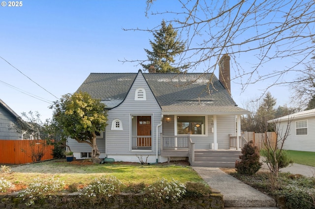 bungalow-style home featuring a porch and a front yard