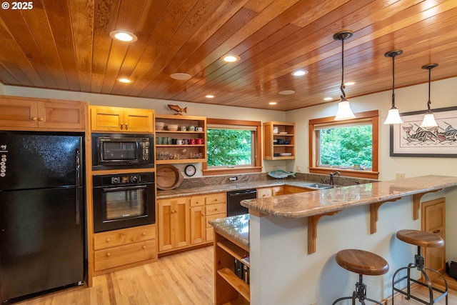 390 Singing Waters Rd, Winchester, OR 97495 - kitchen with black appliances, open shelves, wooden ceiling, a breakfast bar area, and a peninsula