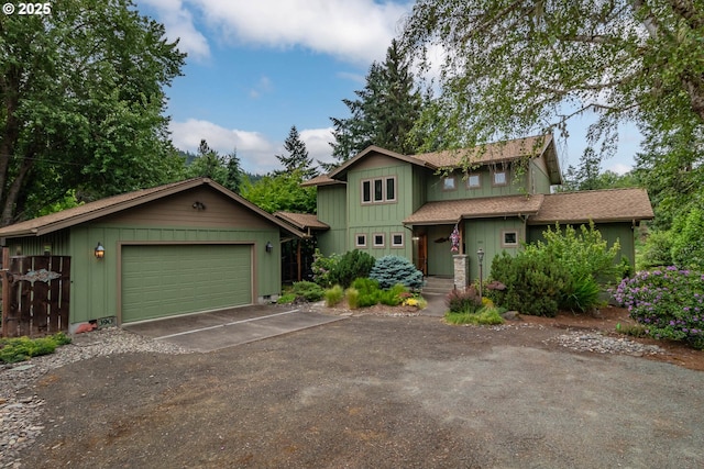 390 Singing Waters Rd, Winchester, OR 97495 - view of front of house featuring driveway, a garage, and roof with shingles