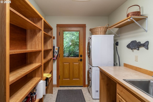 390 Singing Waters Rd, Winchester, OR 97495 - laundry area with stacked washer / dryer and cabinet space