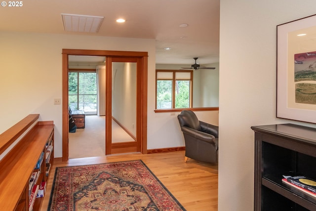 390 Singing Waters Rd, Winchester, OR 97495 - hall with light wood-type flooring, recessed lighting, healthy amount of natural light, and baseboards