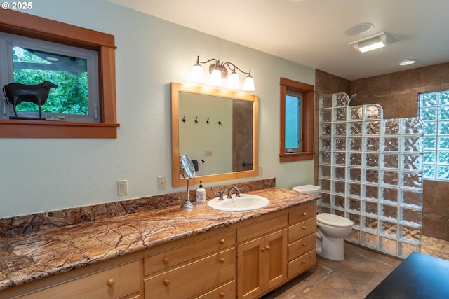 390 Singing Waters Rd, Winchester, OR 97495 - bathroom with walk in shower, toilet, vanity, and tile patterned floors