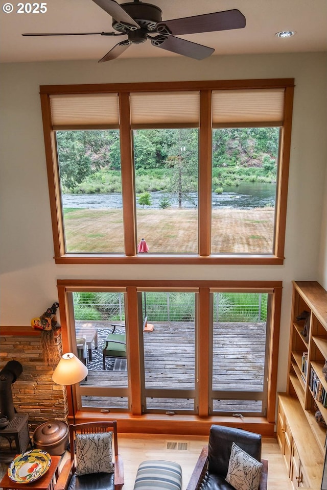 390 Singing Waters Rd, Winchester, OR 97495 - living room with healthy amount of natural light, ceiling fan, light wood-style floors, and recessed lighting