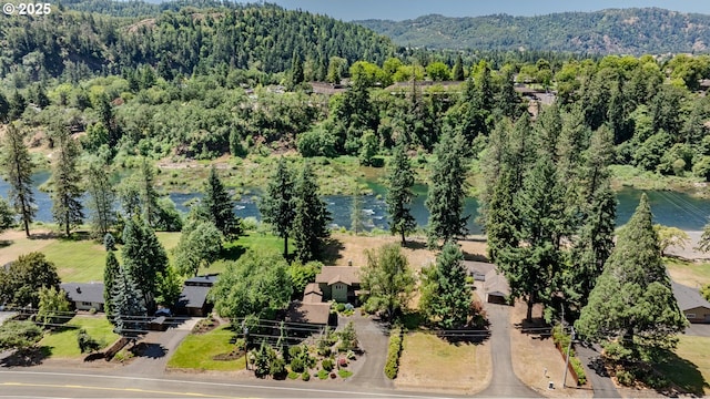 390 Singing Waters Rd, Winchester, OR 97495 - aerial view of a heavily wooded area and a water and mountain view